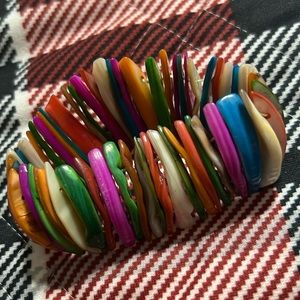 Woman’s multicolored bracelet.